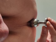 Locked slave plays with butt plug while his mistress is in the kitchen room