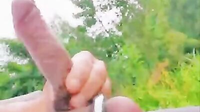 Perverted man pulls out his boner and jerks off in the park