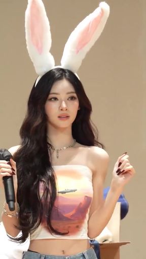 Standing Asian K-pop fan shows off her slim figure