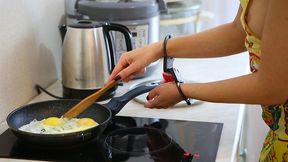 Sofi cooks scrambled eggs in handcuffs