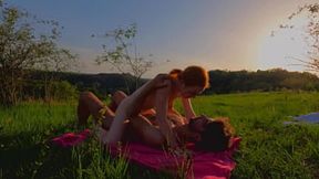 Sweet passion unfolds under summer skies - real couple in wild embrace