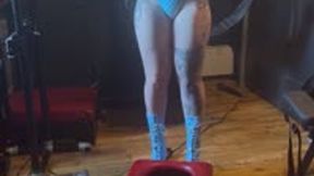 Latex clad mistress covers female slave in her champagne