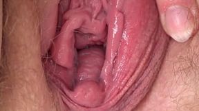 Close-ups of hairy cunt &mdash;  clitoris &mdash;  and vagina  When a mature BBW fingering to orgasm &mdash;  spreading her plump hips