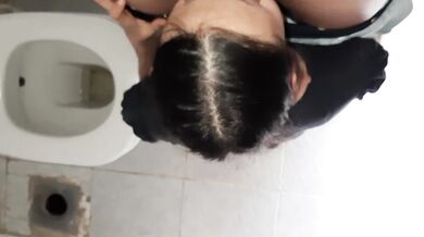 Lesbian in а public toilet with her finger bringing her to orgasm in clothes