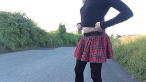 Minx in denim jacket and tartan skirt