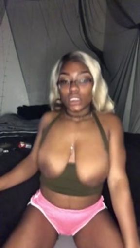 Smoking Milf teases with big tits