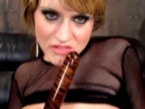 Lusty brunette nympho uses a dildo to have loud orgasm