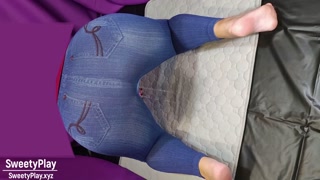 Big ass in jeans peeing with vibrator