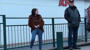 Kinky amateur brunette in fur coat pisses outdoors and makes her jeans wet