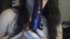 Sucking on a Purple Dildo