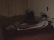 lying on bed alone in empty darkroom