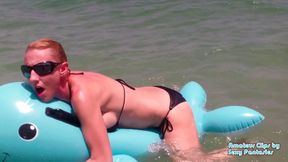 Humping blue inflatable toy in the water at a beach until orgasm