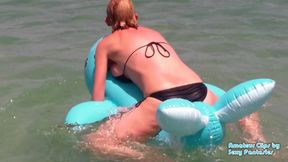 Humping blue inflatable toy in the water at a beach until orgasm