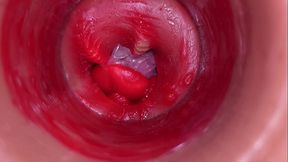 The camera inside the deep pussy records a huge ejaculation with a stuck condom