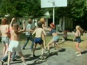 Stunning retro scene with coeds playing basketball outdoors