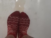 Wetting grey pants and red socks