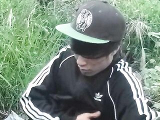 Cute Oriental homo twink in a ebony-and-white adidas tracksuit and Campus sneakers masturbates and cums outdoors