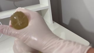 I give a handjob to the dildo with oily hands in medical white gloves