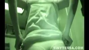 Tessa teases with her tiny tits and ass on the toilet