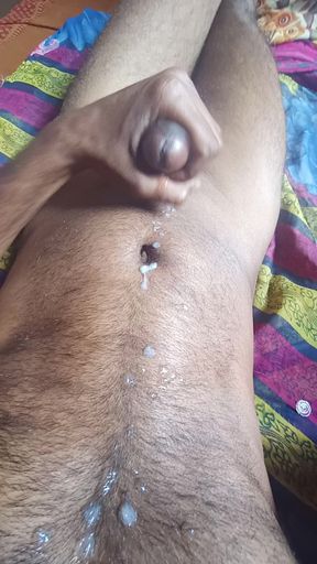 Ejaculating semen from a stiff, well-built Indian penis through masturbation