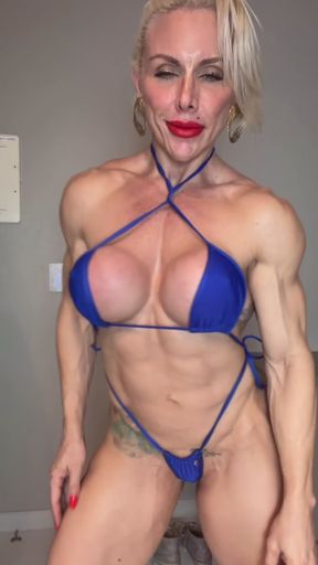 Female bodybuilder in blue bikini