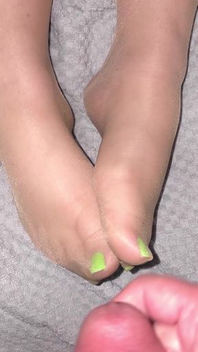 Pantyhose-clad feet get covered in cum
