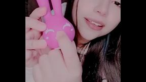 Curious girl masturbating with a bunny toy