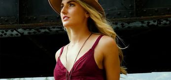 Sweety blonde musician posing public