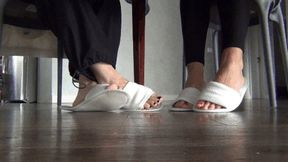 Wiggling our toes under the dining table in slippers d