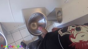 I'm pissing into the urinal of a public restroom and jerking off my thick cock until I'm precumming. I wanted to cum, but...