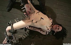 Bound brunette mounted on vibrator