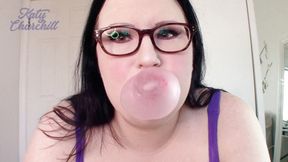 Blowing big pink bubblegum bubbles