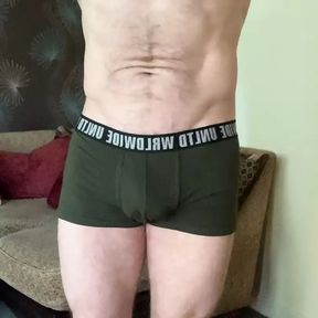 Task Borrow apprentices boxers and sport shorts and model them