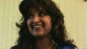 She is in her dress on the couch thinking of stripteasing