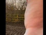 Naked barefoot muddy field
