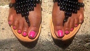 Wonderful Ebony Chick Wearing Flip Flops On Her Sexy Black Feet Outdoors