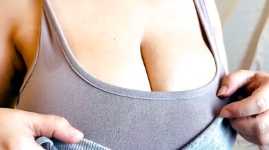 Voluptuous American woman indulges in a sensual oil massage of her large nipples