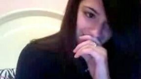 Busty brunette teen licks and kneads her tits in hot webcam solo