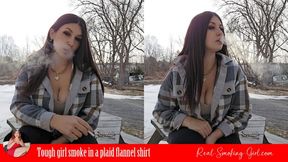 Tough girl smoke in a plaid flannel shirt
