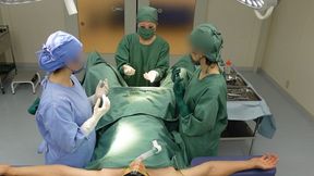 Asian doctors in surgical gowns examine a patient's urethra and anus