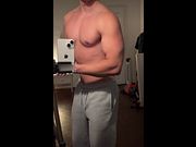 Shirtless Young Bodybuilder Training His Biceps