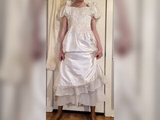 Trying on a liquid satin wedding costume.