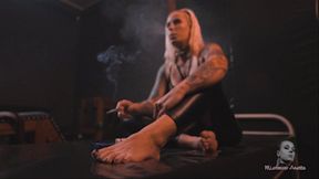 Smoking barefoot on pvc bed 4K MP4