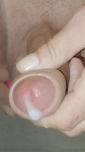 Horny uncut guy playing with long foreskin toys his anus and shoots cum