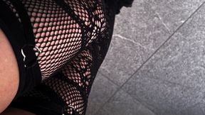 Cleaning in black lace and grey heels