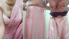 indian gay crossdresser gaurisissy pressing and playing with her big boobs looking in pink saree looking like a housewife