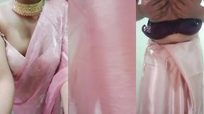 indian gay crossdresser gaurisissy pressing and playing with her big boobs looking in pink saree looking like a housewife
