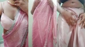 indian gay crossdresser gaurisissy pressing and playing with her big boobs looking in pink saree looking like a housewife