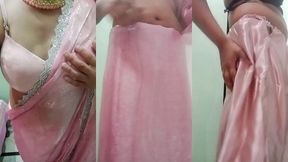 indian gay crossdresser gaurisissy pressing and playing with her big boobs looking in pink saree looking like a housewife