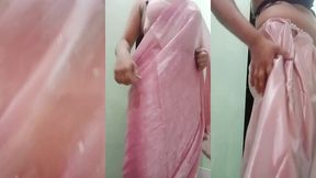 indian gay crossdresser gaurisissy pressing and playing with her big boobs looking in pink saree looking like a housewife